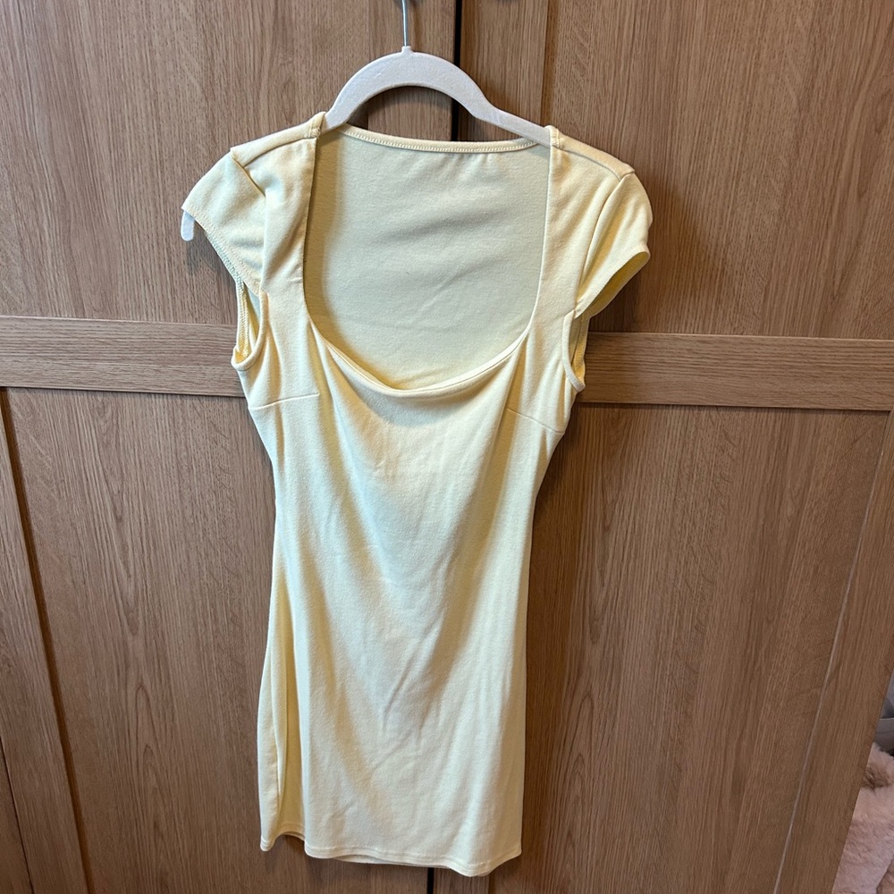 Yellow mini short sleeve bodycon dress, square neckline, open back, built in bra